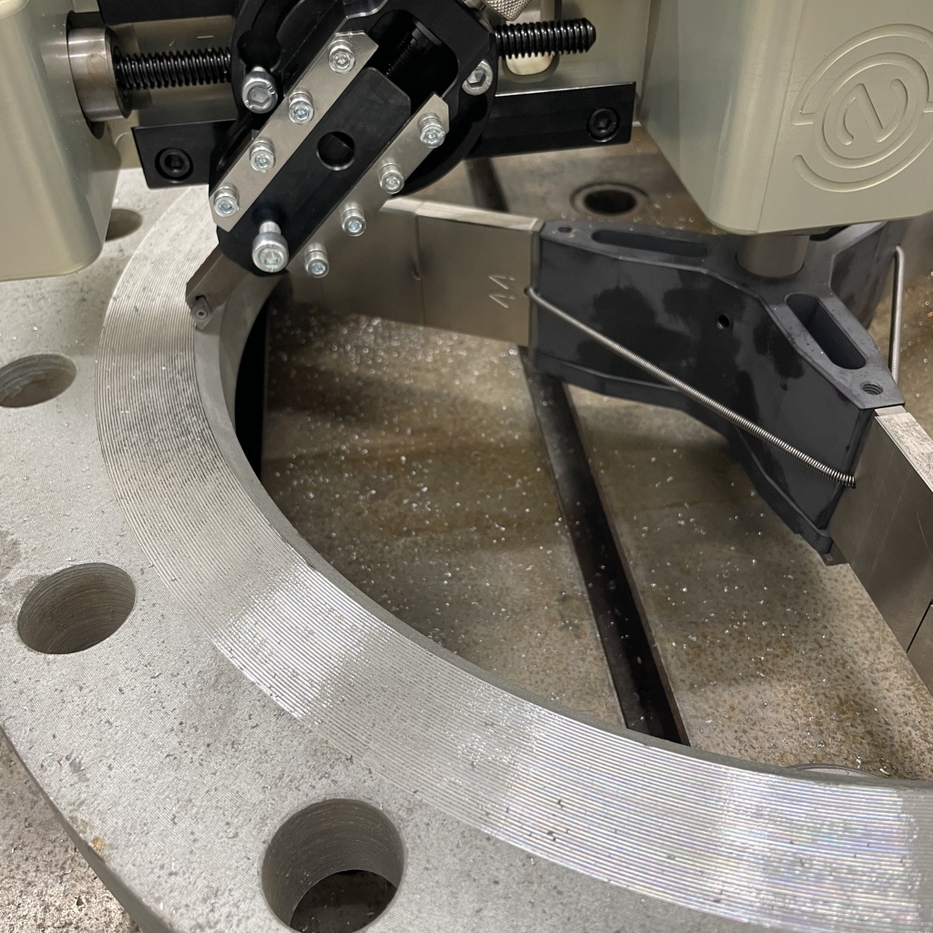 Normaco Manual Facer mounted on a flange with indicator 